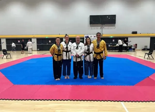 Instructors on the competition mat