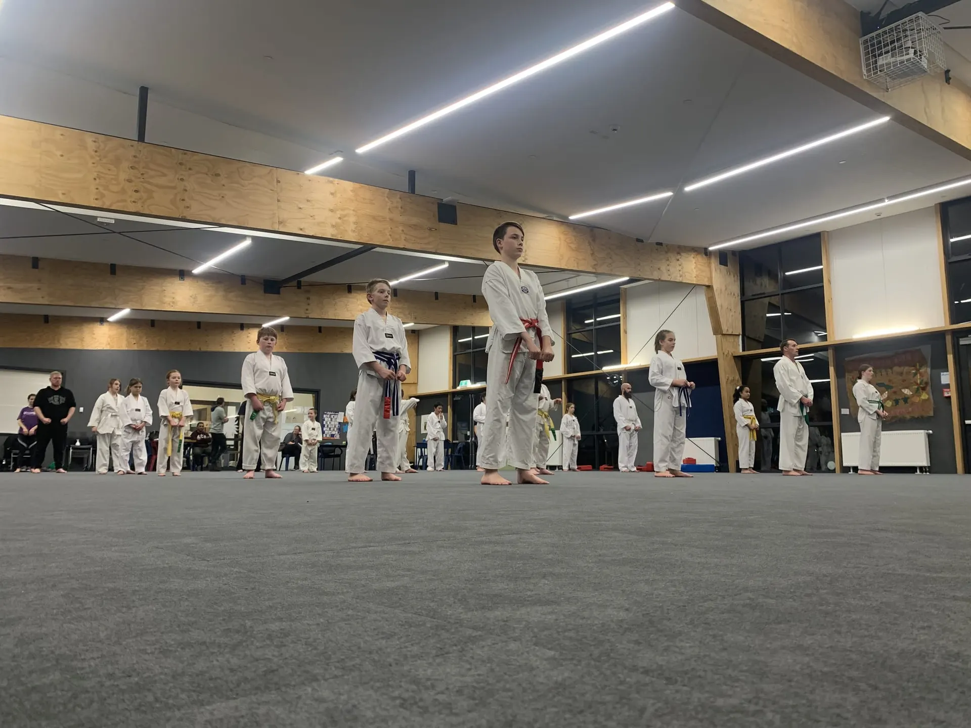 Members of Shirley Olympic Taekwondo lined up in the hall
