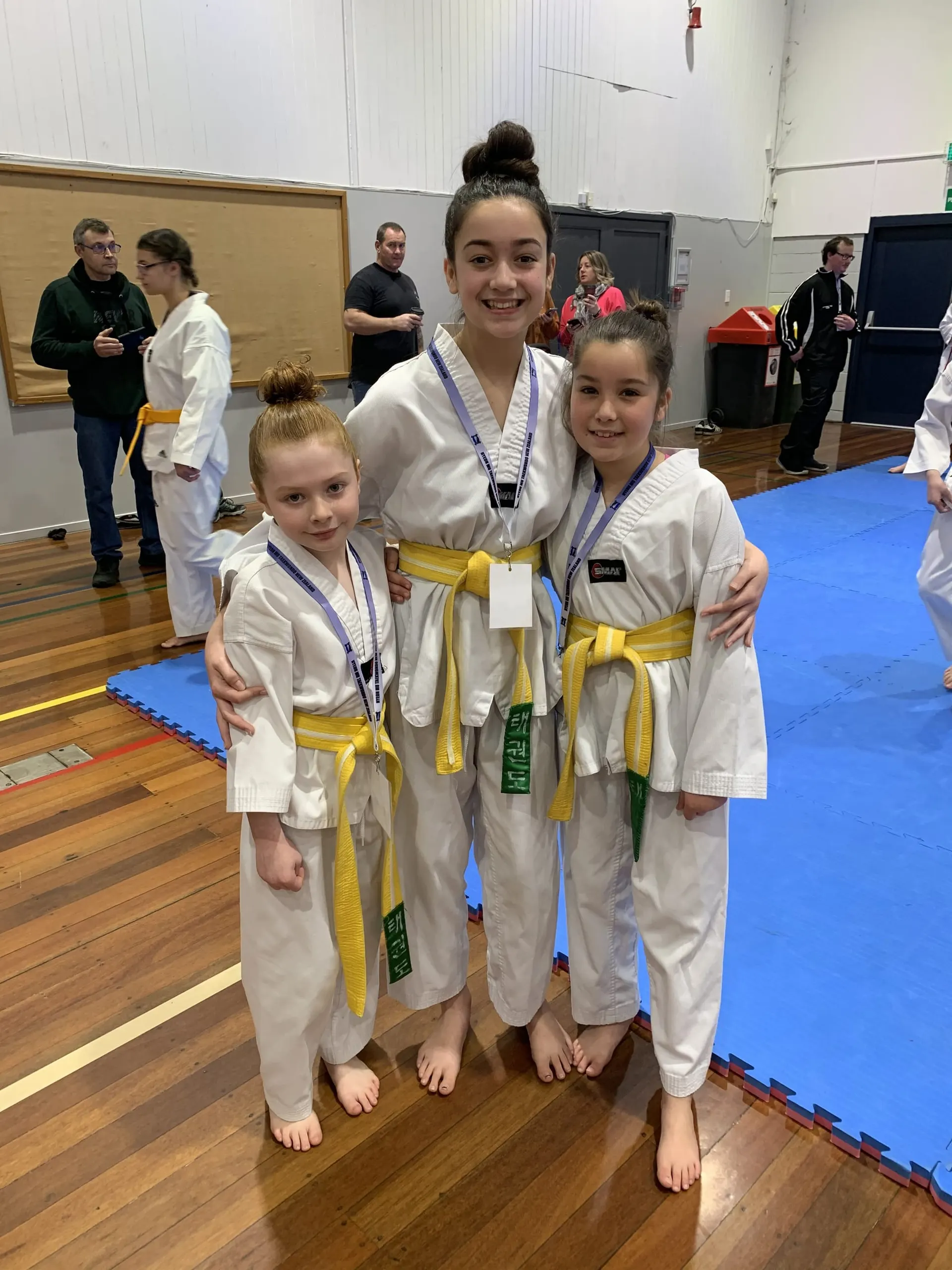 Young students with their gradings and medals